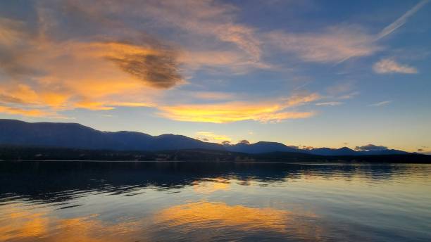 istock Golden streaks on calm waters 1279230575