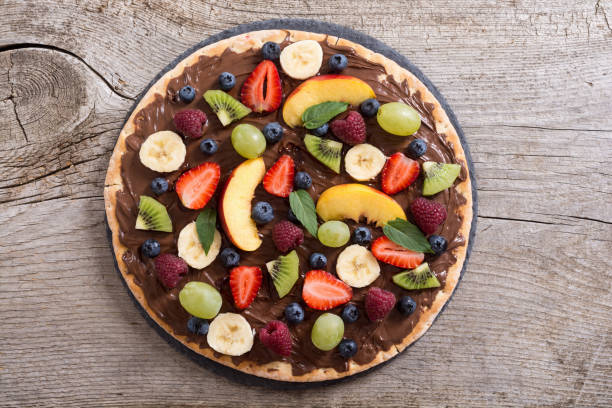 istock Fruit pizza with nut nougat cream , fruit and berries 1279231561
