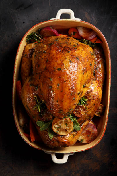 overhead shot of a delicious roasted thanksgiving turkey - lemon food preparation portion imagens e fotografias de stock