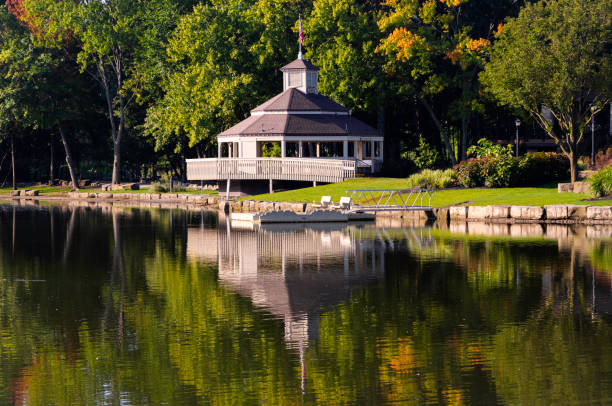 In the public park in Berea, Ohio is the town's bandstand/gazebo. It sits on Coe Lake. The bandstand, trees, and shoreline are reflected in the water of the lake.