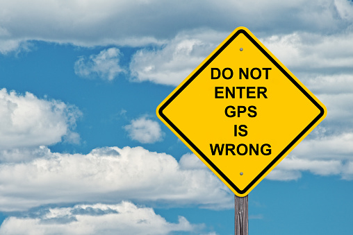 Do No Enter GPS Is Wrong Caution Sign - Blue Sky Background