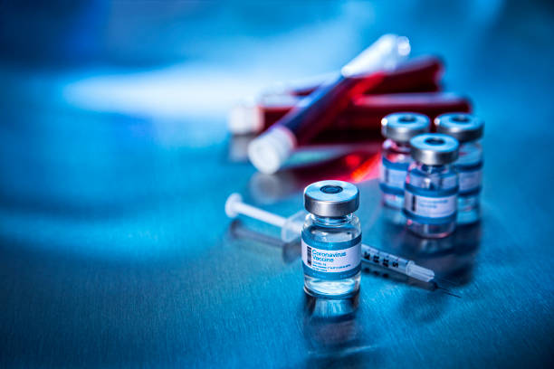 istock Coronavirus vaccine vials and blood samples in hospital 1279233606