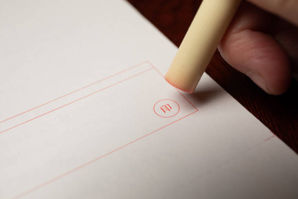 istock White Hanko about to stamp paper 1279236128