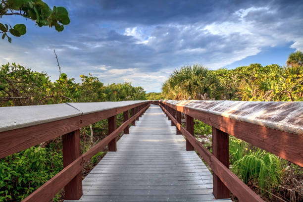 Boardwalk leads down to the white sand of Barefoot Beach