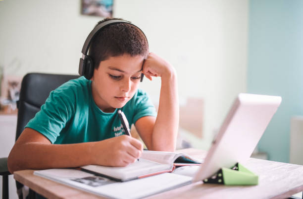 istock Little Boy Is Studying At Home During The Social Distancing And Quarantine 1279240748