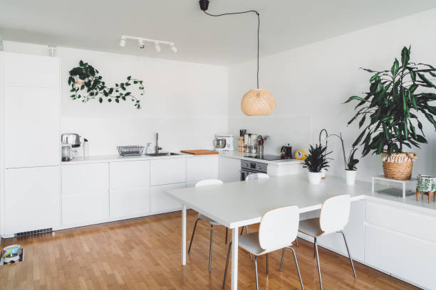 istock All white kitchen and dining table in a modern family home 1279240792