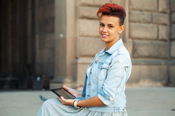 istock Beautiful young woman using a digital tablet 1279241641