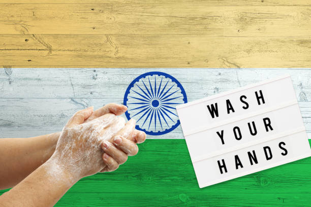 istock India flag background on wooden surface. Minimal wash your hands board with minimal international hygiene concept hand detail. 1279241830