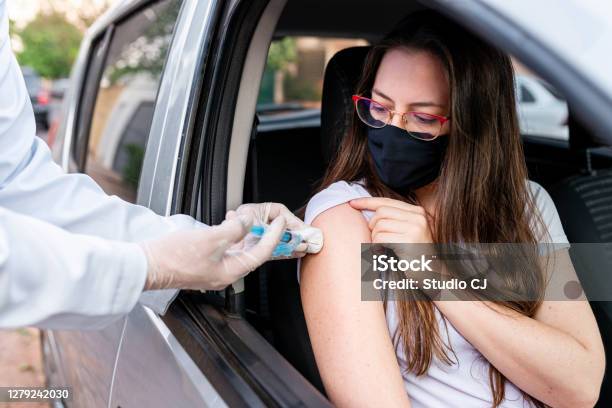 Nurse Performing Drivethru Immunization Stock Photo - Download Image Now - Vaccination, COVID-19 Vaccine, Coronavirus