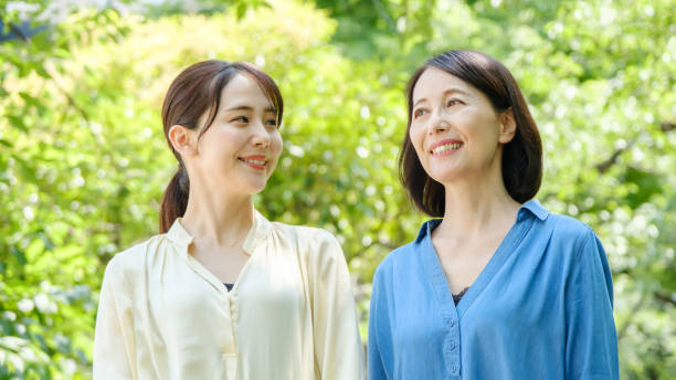 istock asian mother and daughter walking at park 1279243691