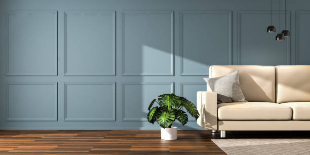 Elegant interior setting with wooden floor, dark paneled wall, sofa, ceiling lamps, carpet and monstrea deliciosa plant. Sunlight falling in, copy space to the left - web banner size. 3d render.