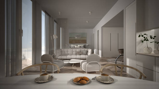 istock One-room apartment, white interior design, parquet, open space: kitchen with dining table, living room with sofa, armchairs, bedroom with double bed. Panoramic windows with curtains 1279245465