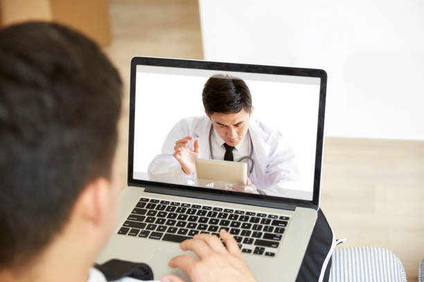 istock young asian man talking to doctor online 1279246270