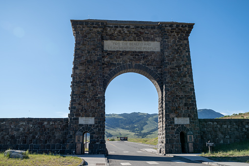 Gardiner, Montana - July 2, 2020: The Roosevelt Arch in the North Entrance of Yellowstone National Park on a sunny day