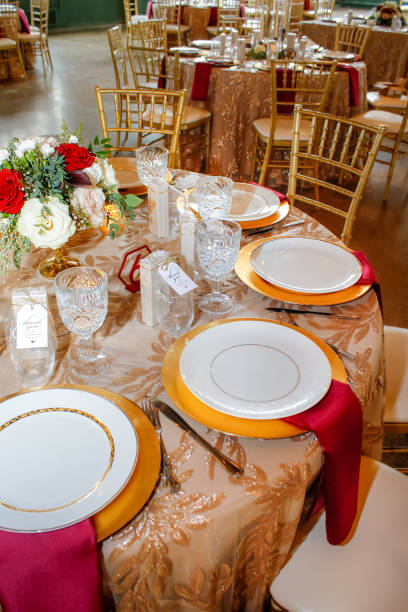 istock Formal settings at empty round table with centerpiece portrait 1279249531