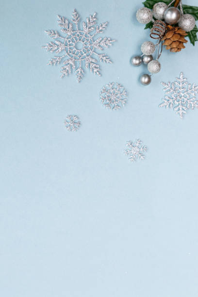 istock Christmas blue background with silver snowflakes beads and thorns 1279252514