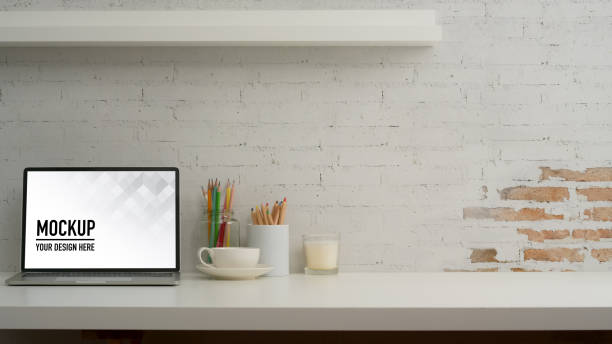 istock Home office desk with mock up laptop, stationery, decorations and copy space 1279253322