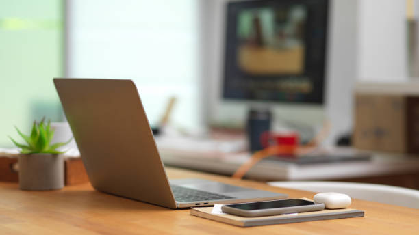 istock Workspace with laptop computer and office supplies on the table 1279254383