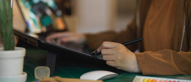 istock Female graphic designer working with digital tablet on computer desk 1279255027
