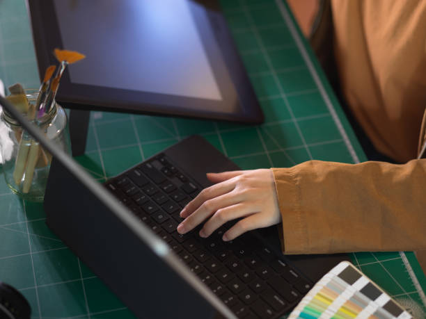 istock Female hand working with digital tablet on worktable in office room 1279255047