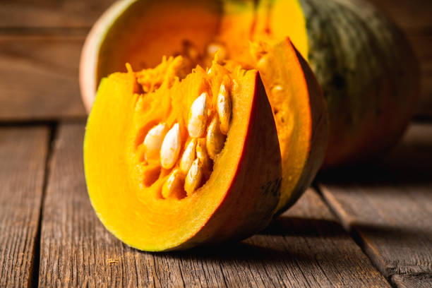 istock Freshly harvested pumpkin sliced on the kitchen table 1279257107