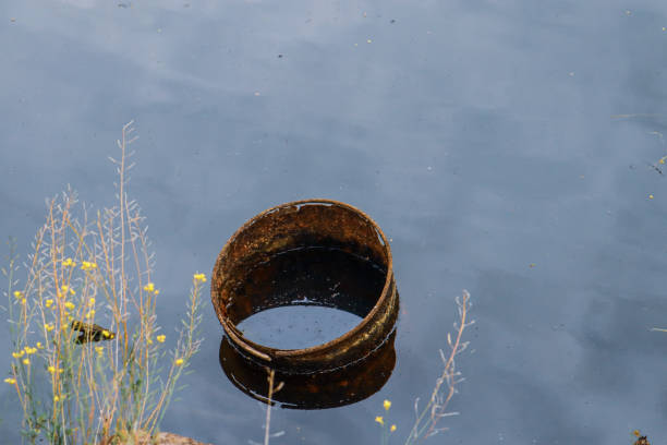 istock rusted oil drum dumped in water 1279257974