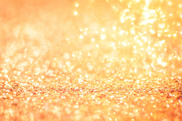 istock Golden festive glitter with hearts bokeh background 1279263578