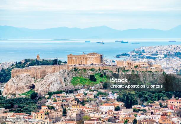 The Acropolis Of Athens With Filopappos Or Philopappou Hill And The Saronic Gulf Stock Photo - Download Image Now