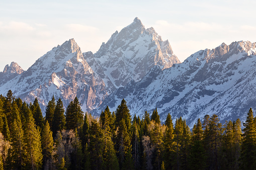 Scenic landscape with sunset light on the snowcapped mountains in Grand Teton National Park, Wyoming, USA