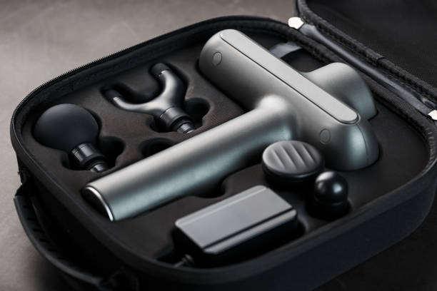 istock Electric massager Machine for body massage in a case on a black background. 1279267222