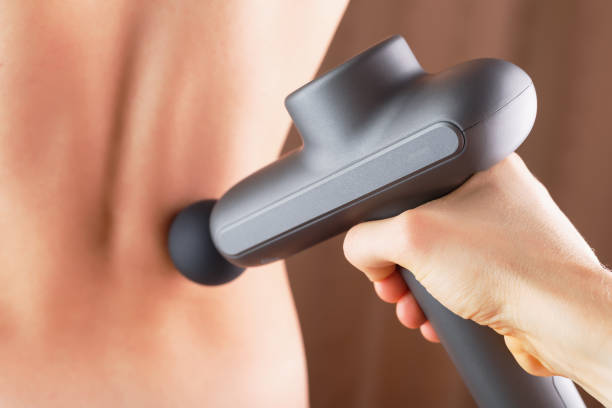 istock Back massage with an Electric body massager. 1279267304