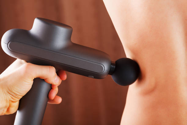 istock Electric Massager drill in hand massages your back. 1279267350