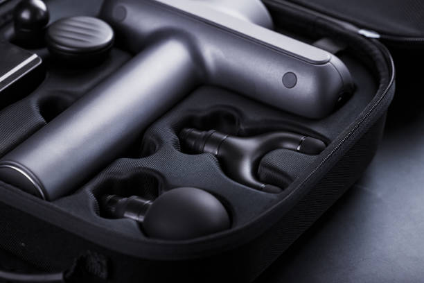 istock Electric massager Machine for body massage in a case on a black background. 1279267374