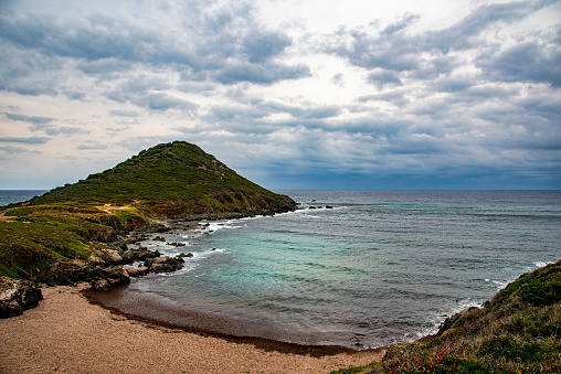 a view of the coast of southern Corsica under an overcast sky