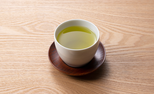 Green tea on a wooden tray. Japanese green tea image