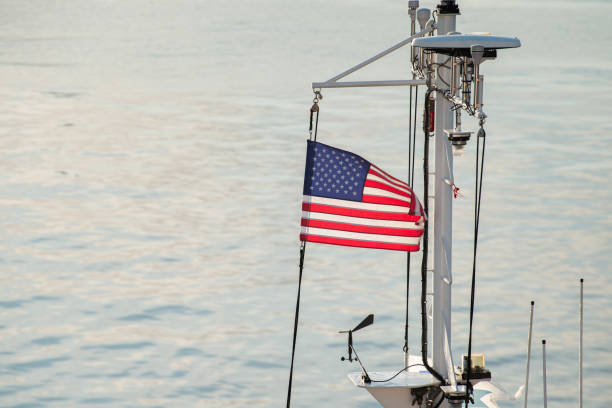 istock American flag on a mast of ship. 1279268643
