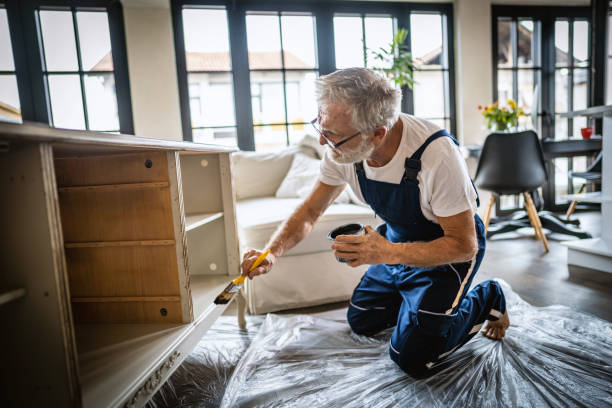 istock Senior man restoring a showcase at home 1279269805