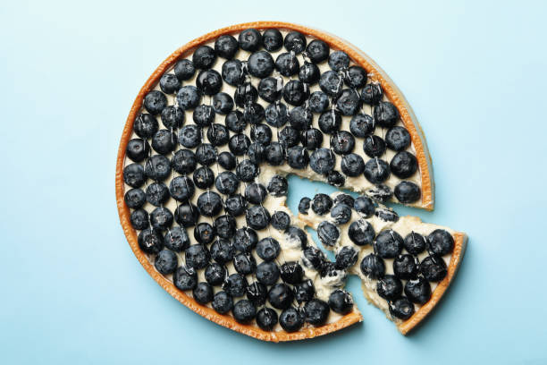 istock Blueberry pie on blue background, top view 1279273497