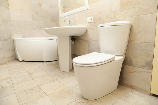 Modern comfortable bathroom in light beige color