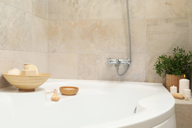 istock Bath with personal hygiene accessories in light beige bathroom 1279274588