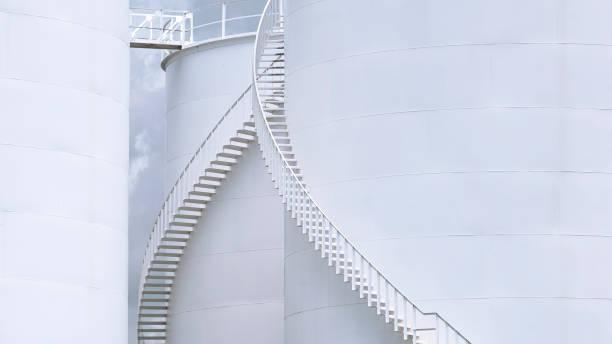 istock Curve spiral staircase on white storage fuel tanks 1279274609