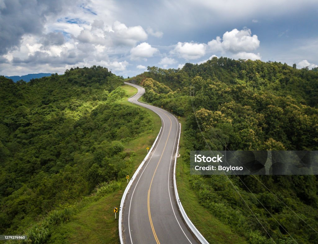 Aerial view of beautiful steep curved road (look like number 3) on the high mountain in Nan province, Thailand. An iconic tourist attraction place on the way to Bo Kluea (means salt well) district. Road Stock Photo
