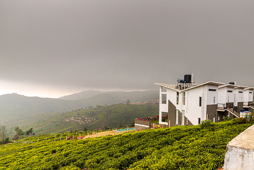mountain and city landscape with clouds and the beautiful tea plantations in ooty