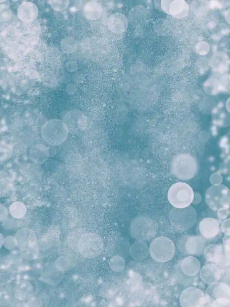 Vector illustration of Blue Glitter Abstract Background with Snowflakes. Blue blur bokeh lights, defocused background. Design element for christmas and new year cards.
