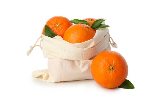 istock Cotton bag with ripe mandarins isolated on white background 1279275883