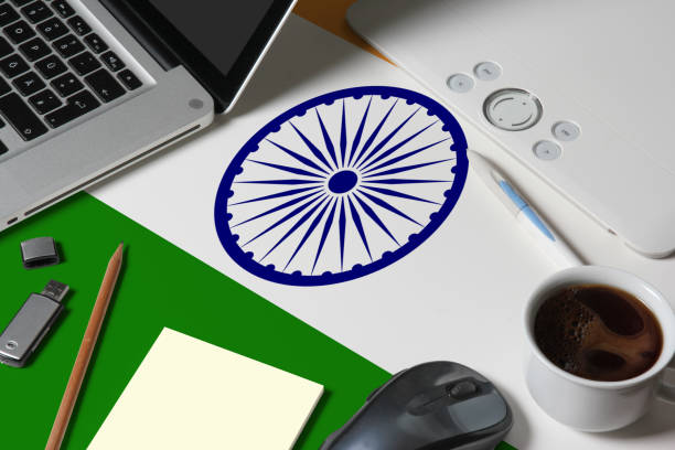 istock India national flag on top view work space of creative designer with laptop, computer keyboard, usb drive, graphic tablet, coffee cup, mouse on wooden table. 1279276953