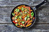 kung pao tofu with mixed peppers, broccoli and scallions