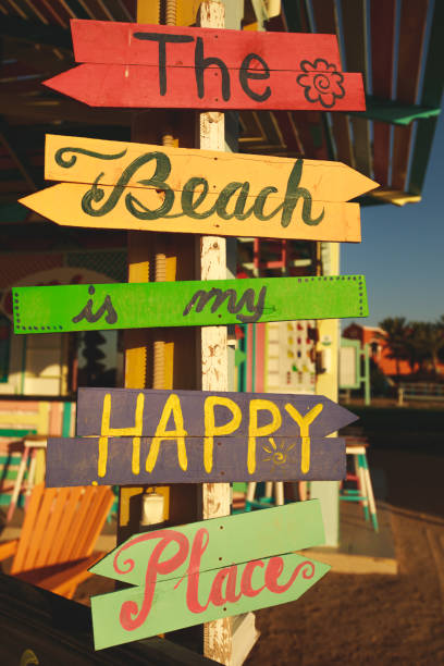 istock 'The beach is my happy place' sign 1279278104