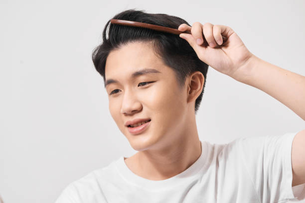 istock Handsome smiling young man doing modern hairstyle 1279278433