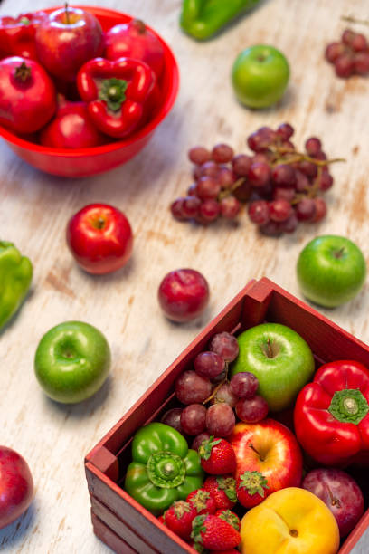 Madrid, Spain October 6, 2020. Box with fruits and vegetables on white kitchen table